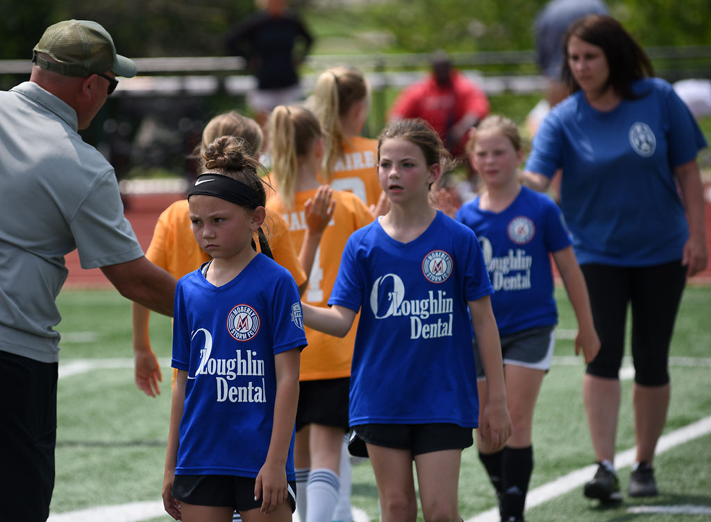 Delaney Smyser, left, walks through post-game handshakes